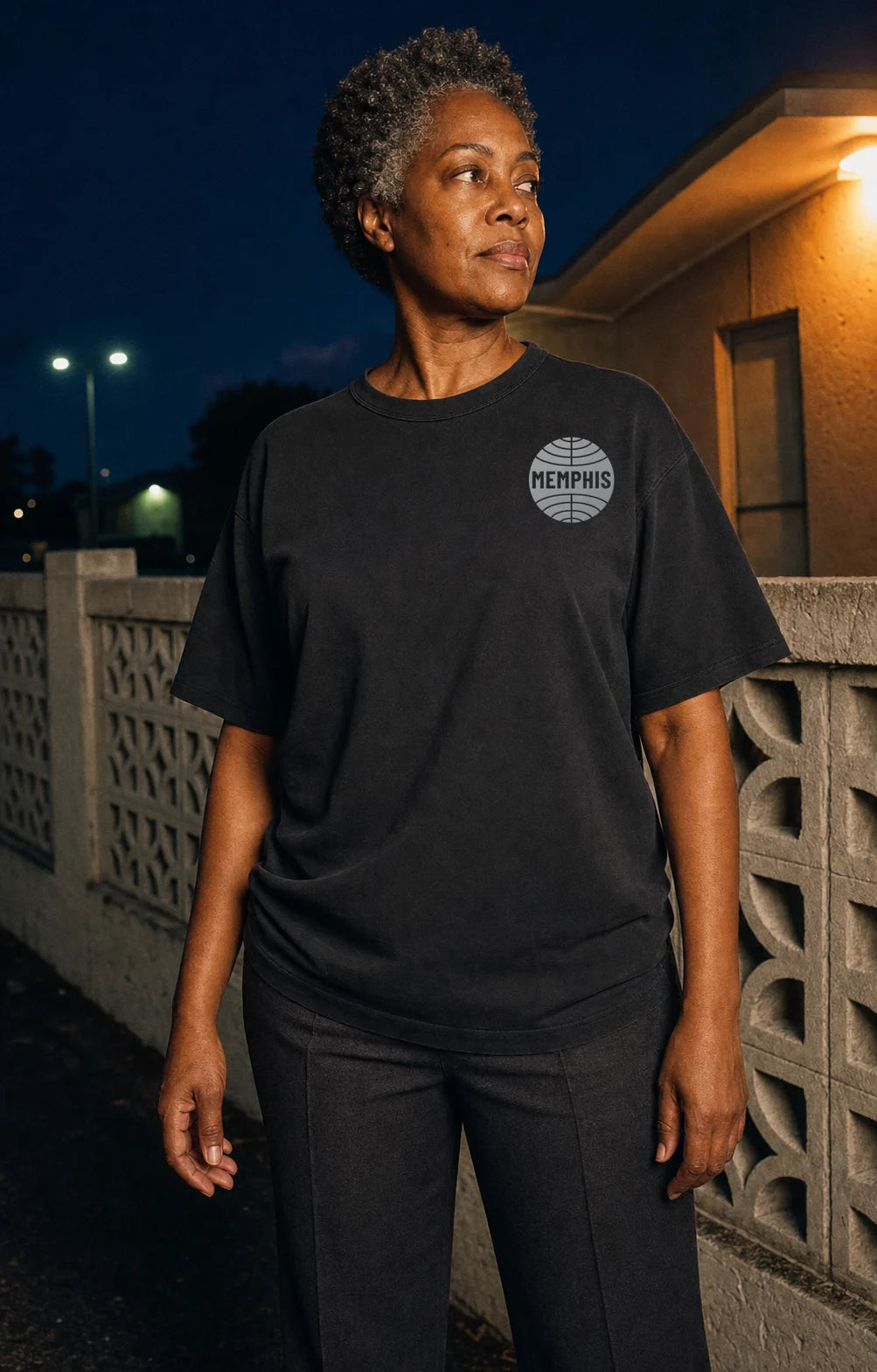 Model wearing a black PAN AM MEMPHIS globe tee